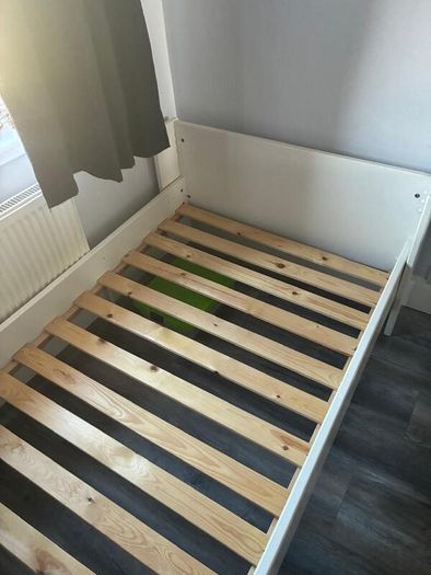 White single bed frame with wooden slats