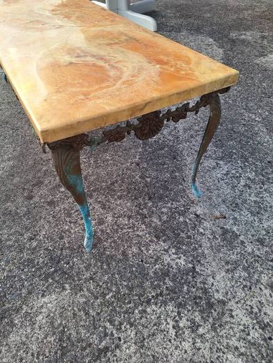 Vintage metal coffee table in need of restoration