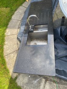 Black marble counter top with tap and under mounted sink