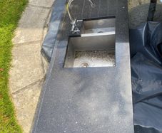 Black marble counter top with tap and under mounted sink