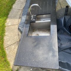 Black marble counter top with tap and under mounted sink
