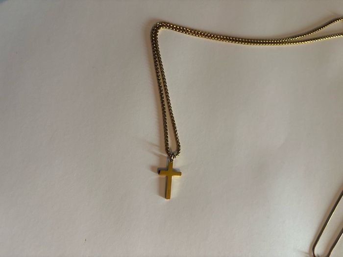 Gold cross.