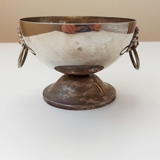 Small silver plated bowl with handles cast as lion's head holding a ring