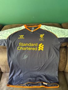 Luis Suarez signed Liverpool jersey