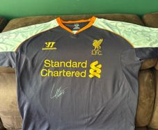 Luis Suarez signed Liverpool jersey