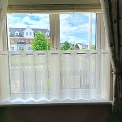 Cream pleated cafe nets and assorted tension rods to suit