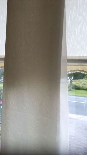 Cream/ivory voille curtains.