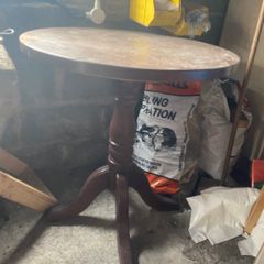 Round pedestal side table - dark wood finish
