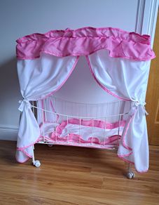 Antique Dolls bed on wheels