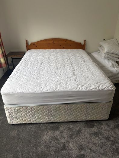 5ft Bed that splits on two. Includes the mattress and headboard.