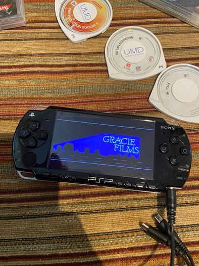 PSP  Console plus 10 games, charger and headphones