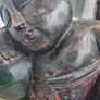 A large wooden statue of a sleeping Buddha Image 8