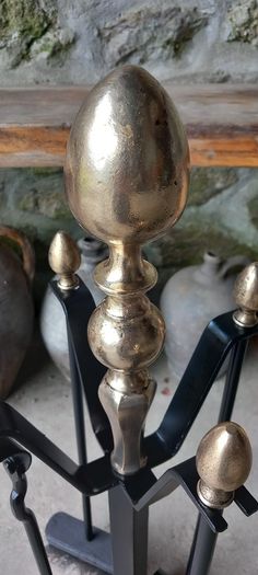 Antique Fire dogs and 4 piece fire set solid brass tops and steel