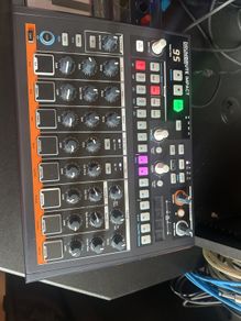 Arturia Drumbrute Impact and desk saver