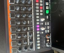 Arturia Drumbrute Impact and desk saver