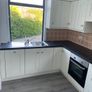 Kitchen including integrated dishwasher and cooker Image 2