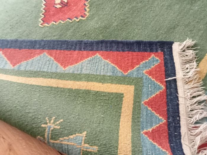 hand-knotted green Gabbeh rug