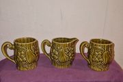 Vintage Japanese green embossed ceramic pair of mugs and milk jug