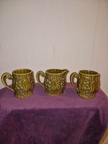 Vintage Japanese green embossed ceramic pair of mugs and milk jug