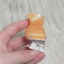 orange calcite parrot carving Image 6