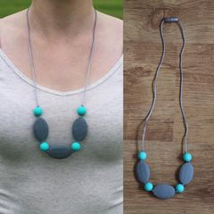 Turquoise and grey teething necklace for babies and parents.