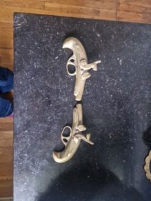 brass pistols