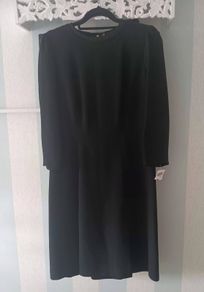Vintage Black Dress with signature hardware.