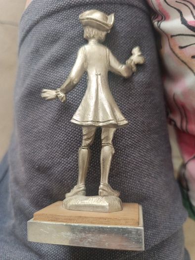 The figurine is a vintage