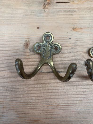 Two brass hooks