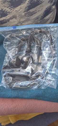2 Curtain Poles and 2 Hold Backs