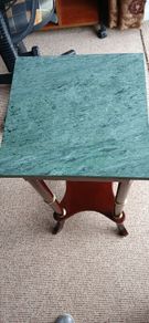 a pair of vintage marble top tables