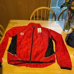 Cycle stowaway jacket. Brand Opitmum