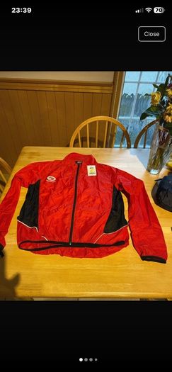 Cycle stowaway jacket. Brand Opitmum