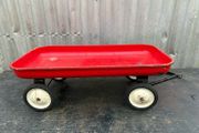 Vintage little tin red pull along wagon. c1960