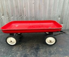 Vintage little tin red pull along wagon. c1960