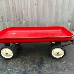Vintage little tin red pull along wagon. c1960