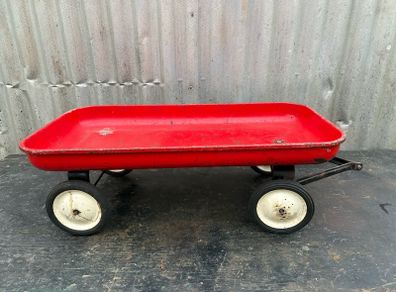 Vintage little tin red pull along wagon. c1960