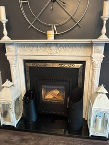 Ornate white marble fireplace surround
