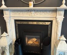 Ornate white marble fireplace surround