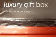new luxury gift box Red with tissue paper in wrapping