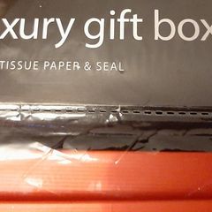 new luxury gift box Red with tissue paper in wrapping