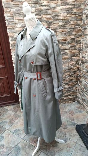 Vintage Nuage ladies trenchcoat Approximately late 90s early 00s Size 10 on label The colour is a pale bluey grey with brown buttons It's got an inner lining that can be removed