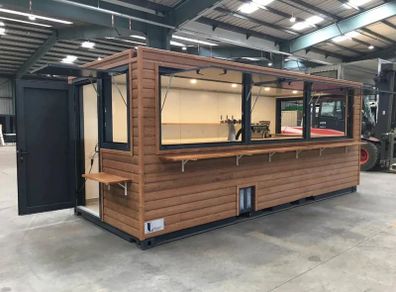 A 6-meter (20-foot) shipping container housing a cafe, with a very minimalist design