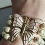 A beautiful faux pearl butterfly bracelet. Image 7