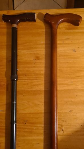 Walking Sticks. 1 X Classic Wood Walking Stick. And 1 X Metal Adjustable Walking Stick. Both In Good Condition.
