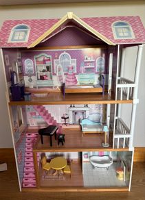 Large wooden dolls house with furniture