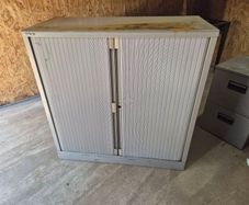 Roll door shelf unit