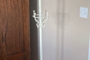 Cream coat umbrella and handbag rack