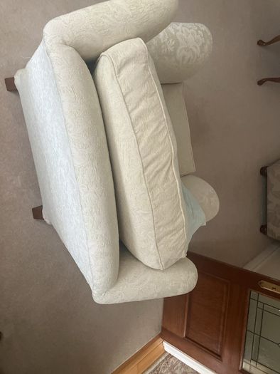 Cream armchair on brass caster