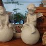 Lovely Vintage Pair of Ceramic Baby Winged Angels Sitting on Globes with a Very Tactile Cream Coloured Crackle Glaze Image 3